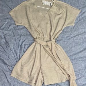 H&M Romper. Size Medium. *NEVER WORN. New w tags*